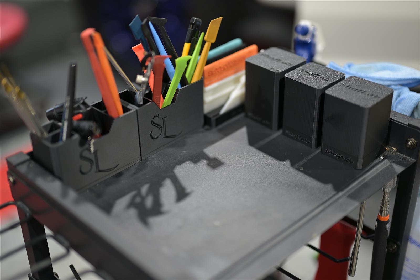 Desktop magnetic organizer holding professional wrap and detailing tools