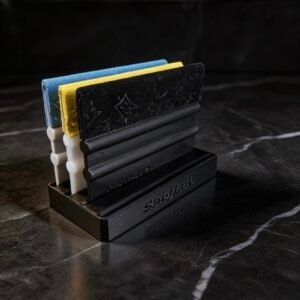 Compact magnetic organizer holding several professional squeegees